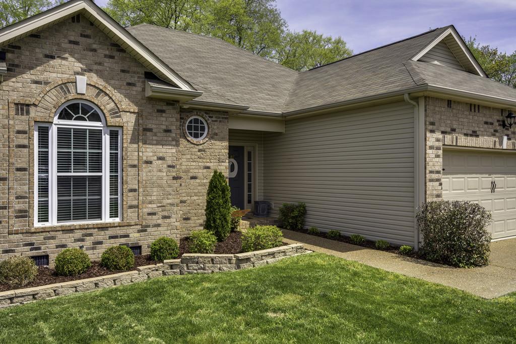 1056 Golf View Way Spring Hill, TN 37174 - Photo 4 of 29 a front view of a house with garden