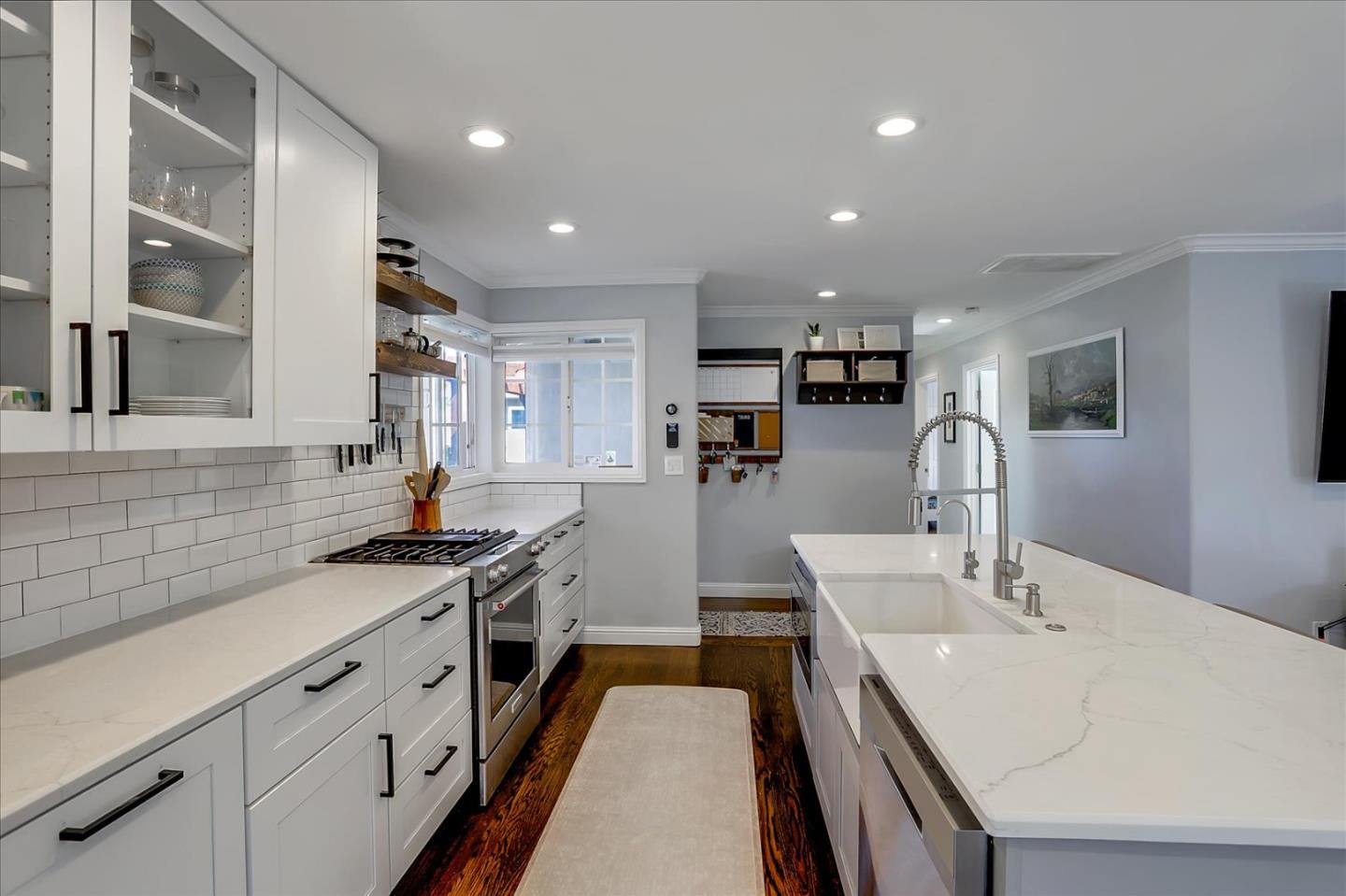 1220 Redcliff Drive San Jose, CA 95118 - Photo 13 of 39 a kitchen with counter top space a sink stainless steel appliances and cabinets