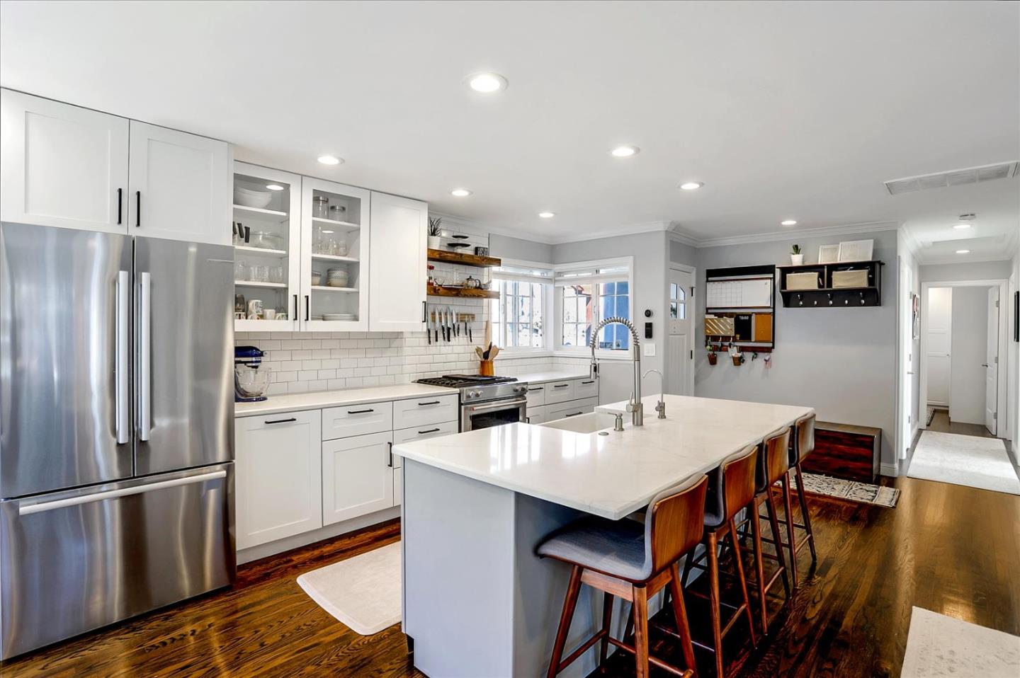 1220 Redcliff Drive San Jose, CA 95118 - Photo 14 of 39 a kitchen with stainless steel appliances a sink a stove a refrigerator cabinets and dining table
