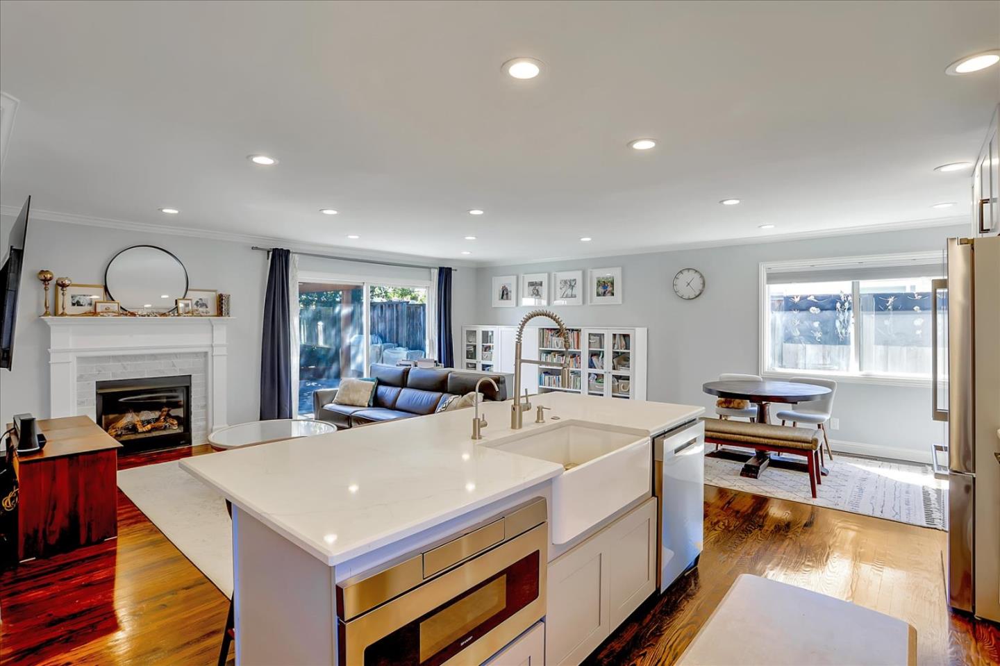 1220 Redcliff Drive San Jose, CA 95118 - Photo 16 of 39 a large living room with stainless steel appliances granite countertop a stove and a fireplace