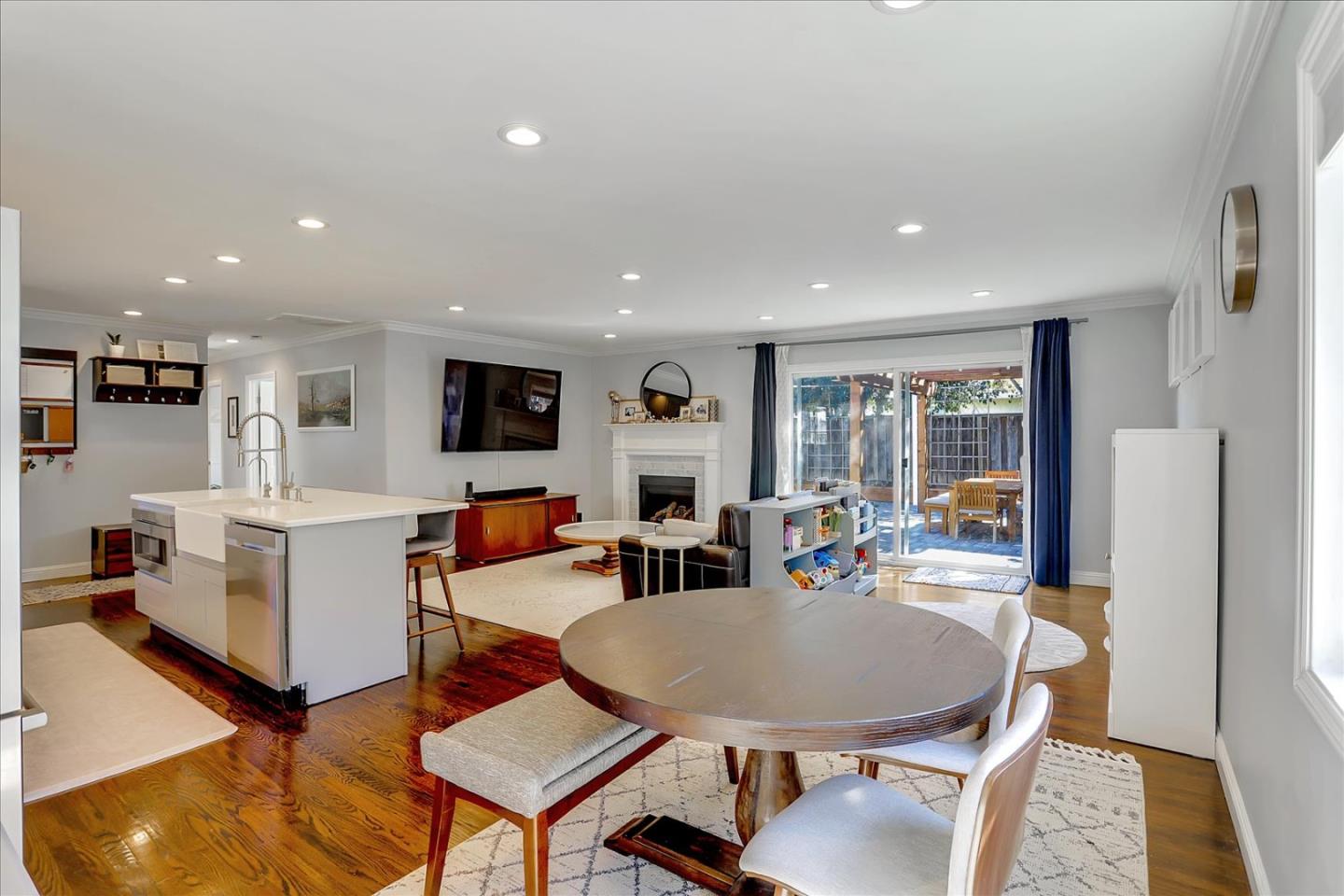 1220 Redcliff Drive San Jose, CA 95118 - Photo 17 of 39 a living room with furniture a flat screen tv and a table