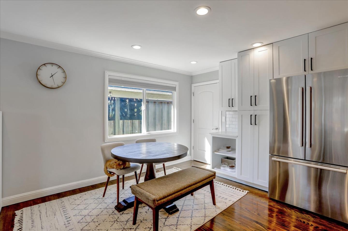1220 Redcliff Drive San Jose, CA 95118 - Photo 18 of 39 a kitchen with stainless steel appliances granite countertop a refrigerator a sink a stove and a dining table with wooden floor