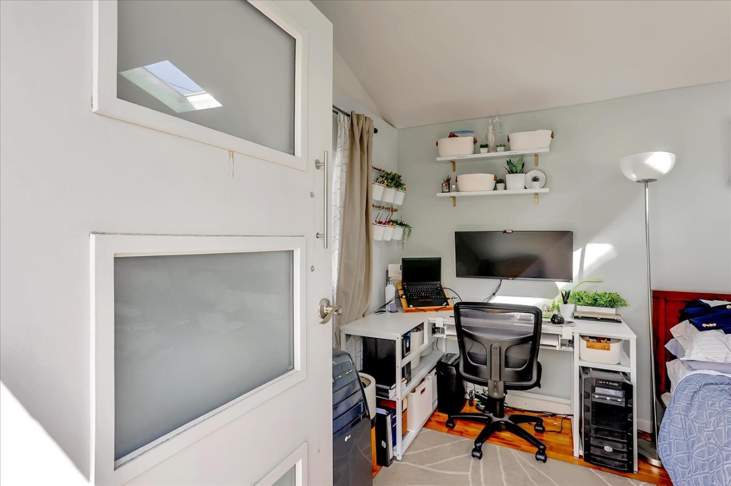 1220 Redcliff Drive San Jose, CA 95118 - Photo 20 of 39 a view of a workspace with furniture and a flat screen tv