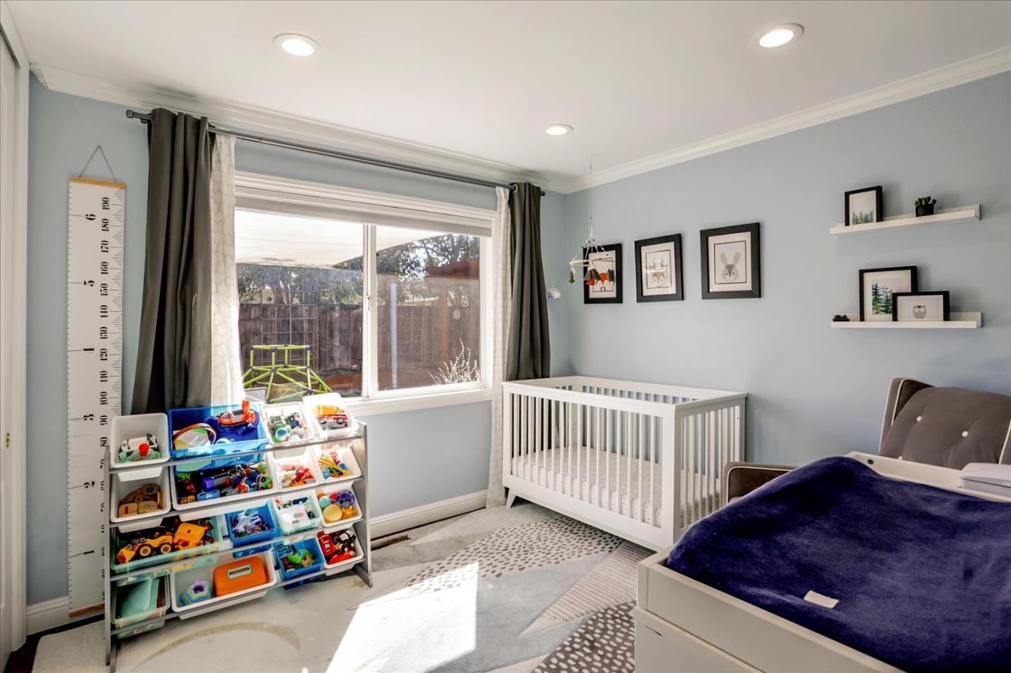 1220 Redcliff Drive San Jose, CA 95118 - Photo 22 of 39 a bedroom with baby crib and a window