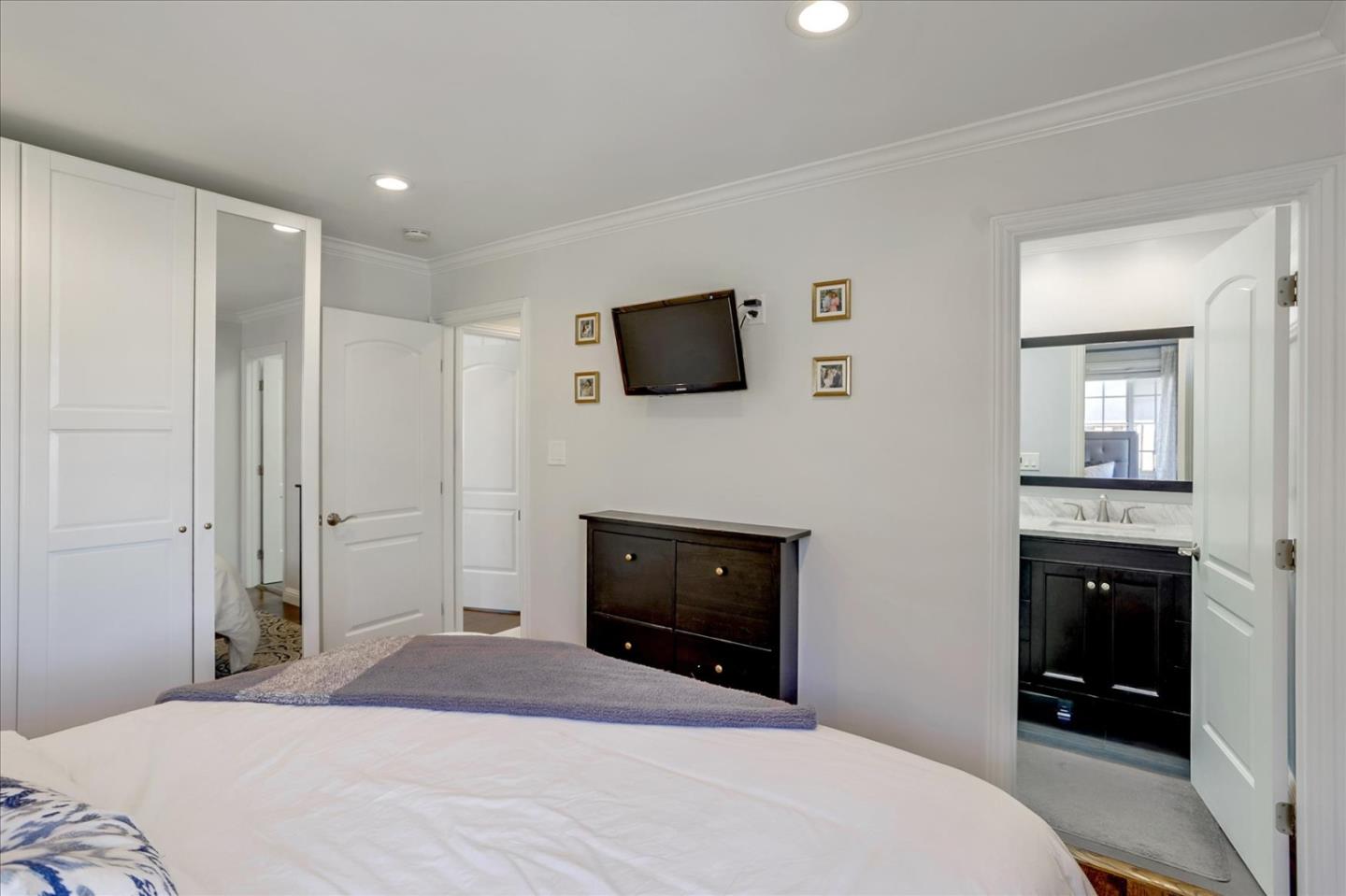 1220 Redcliff Drive San Jose, CA 95118 - Photo 26 of 39 a bedroom with a bed and a flat screen tv