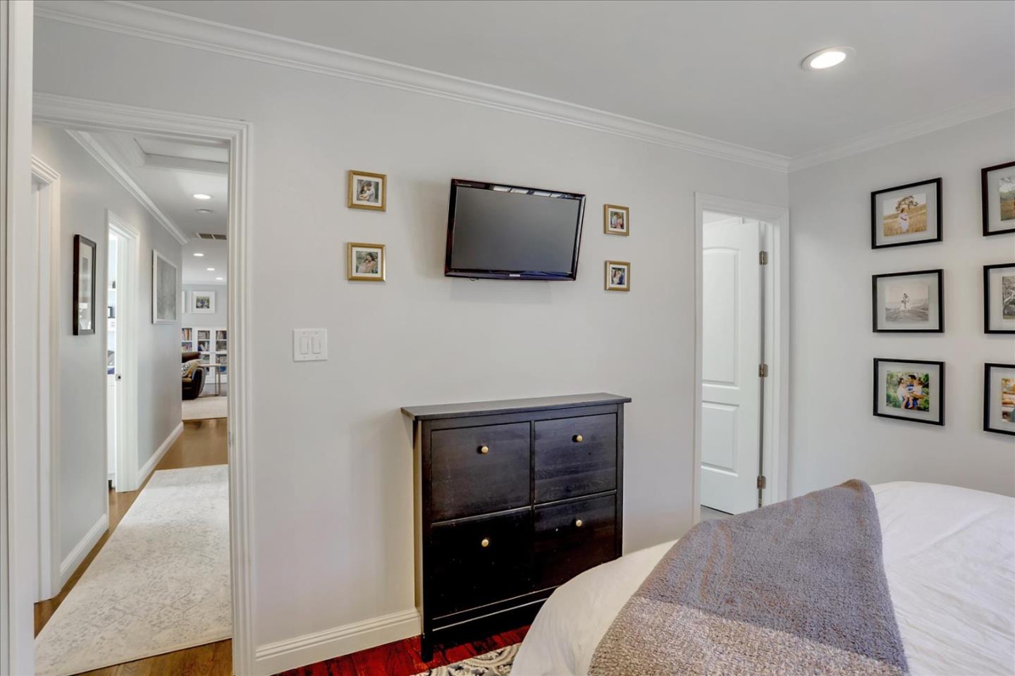 1220 Redcliff Drive San Jose, CA 95118 - Photo 27 of 39 a bedroom with a bed and a television