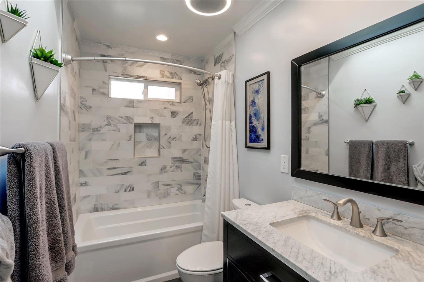 1220 Redcliff Drive San Jose, CA 95118 - Photo 28 of 39 a bathroom with a granite countertop sink toilet and shower