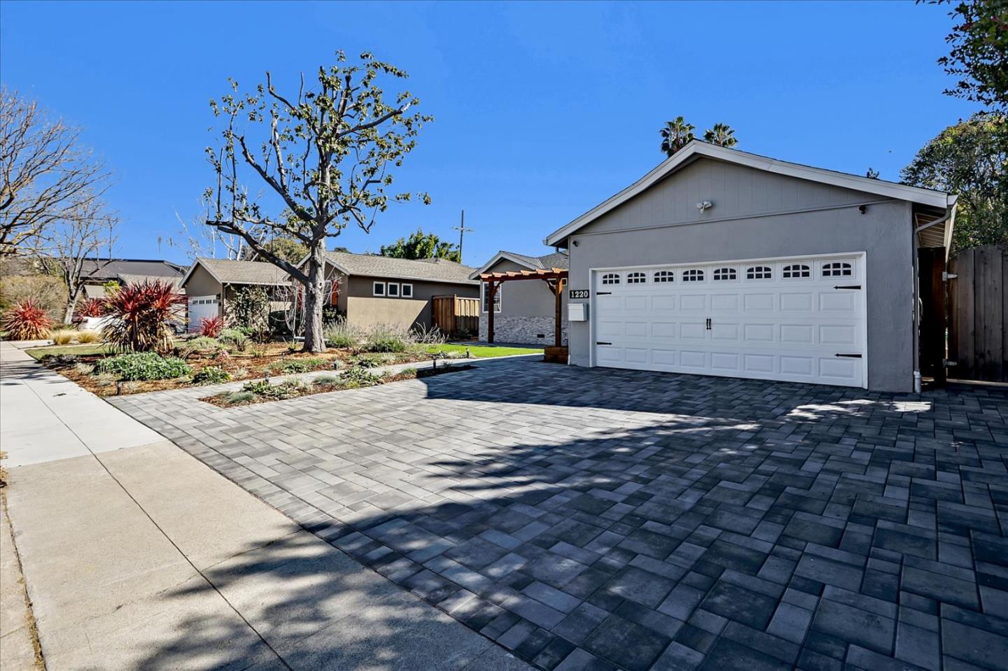 1220 Redcliff Drive San Jose, CA 95118 - Photo 3 of 39 a view of a house with a yard
