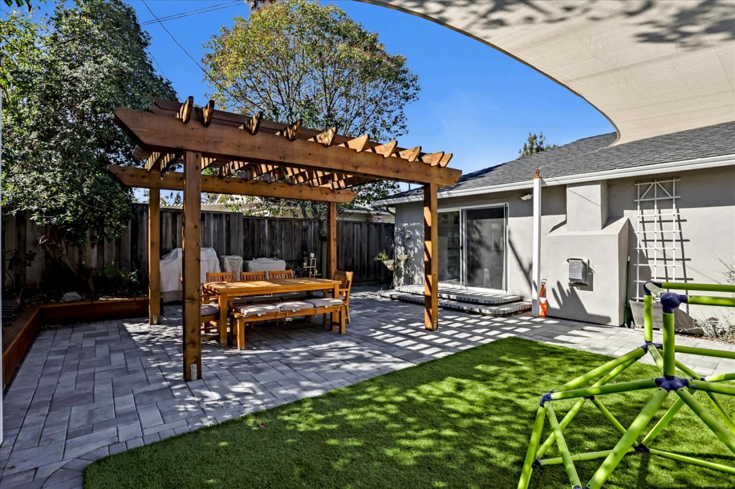 1220 Redcliff Drive San Jose, CA 95118 - Photo 32 of 39 a view of a house with backyard sitting area and porch