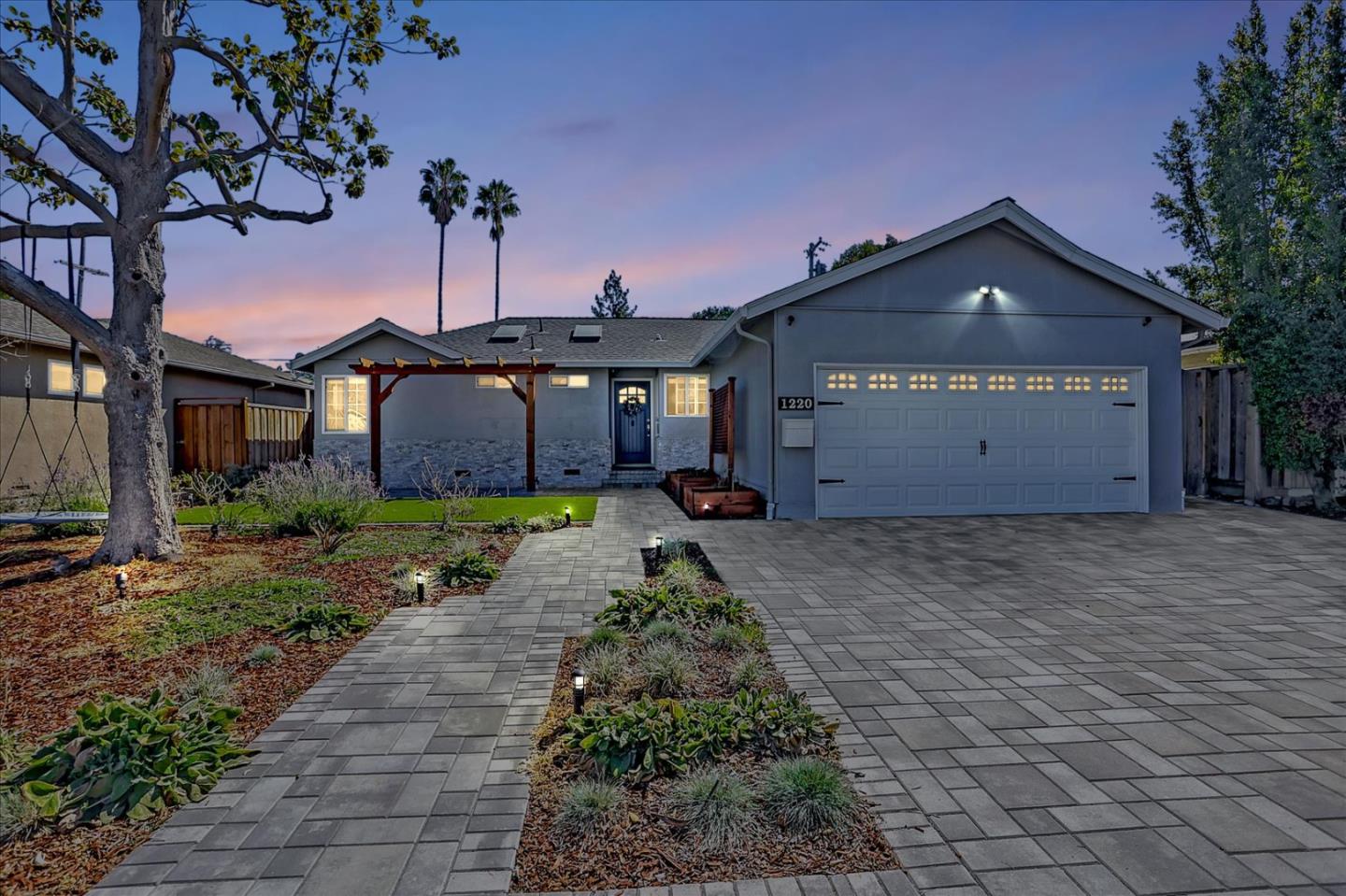 1220 Redcliff Drive San Jose, CA 95118 - Photo 38 of 39 a front view of a house with a yard and garage