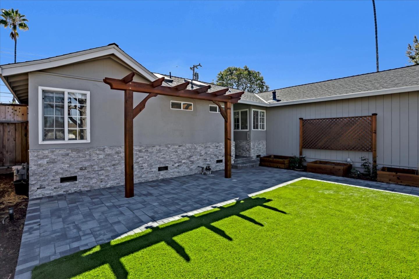 1220 Redcliff Drive San Jose, CA 95118 - Photo 4 of 39 a front view of a house with garden
