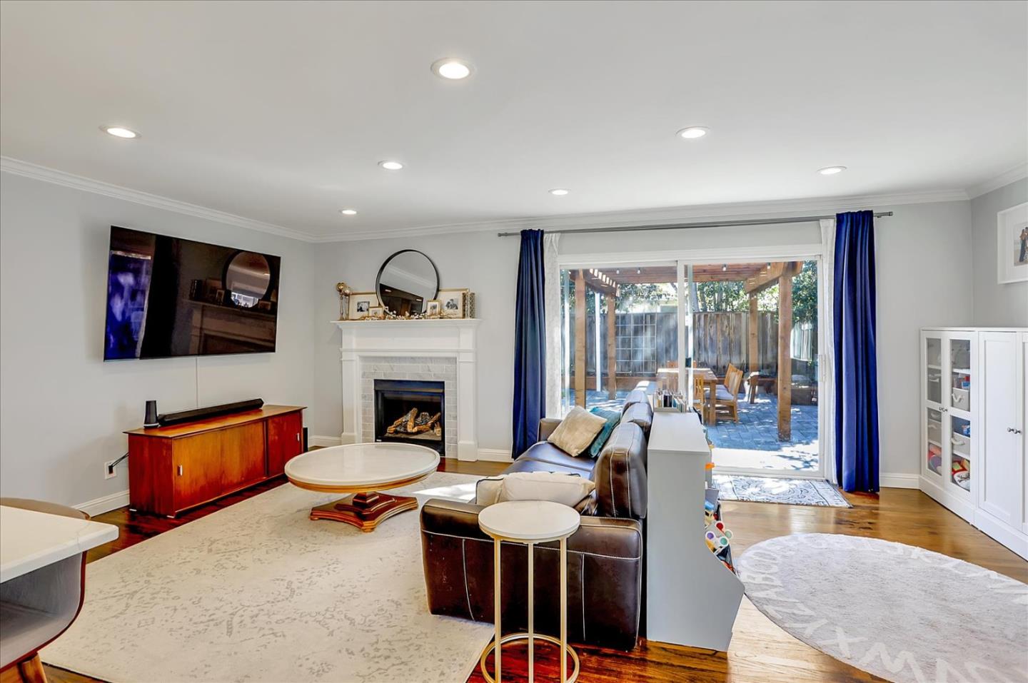 1220 Redcliff Drive San Jose, CA 95118 - Photo 10 of 39 a living room with fireplace furniture and a flat screen tv