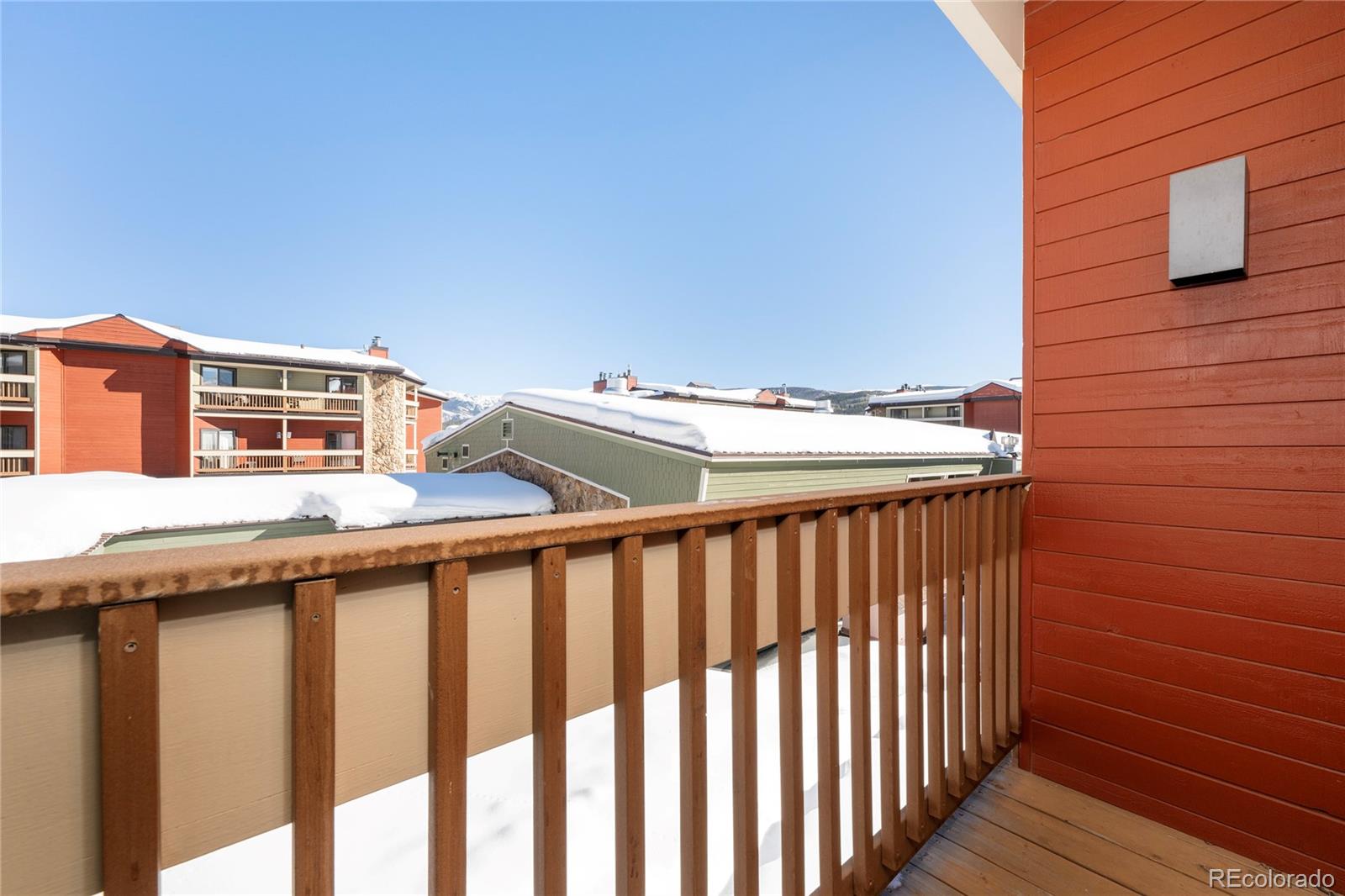 490 Kings Crossing Road, Unit 321 Winter Park, CO 80482 - Photo 13 of 46 a view of a balcony with wooden fence