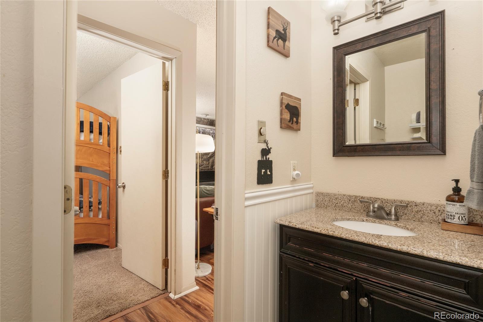 490 Kings Crossing Road, Unit 321 Winter Park, CO 80482 - Photo 15 of 46 a bathroom with a sink and a mirror