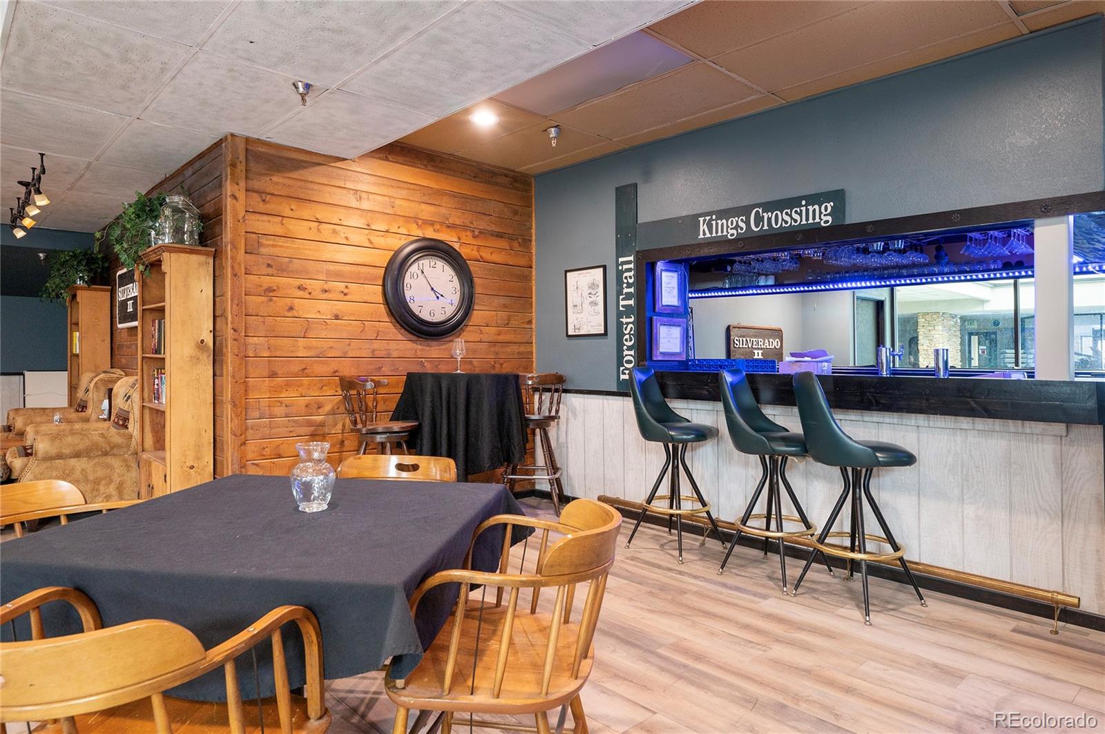 490 Kings Crossing Road, Unit 321 Winter Park, CO 80482 - Photo 26 of 46 a view of a dining room with furniture and wooden floor