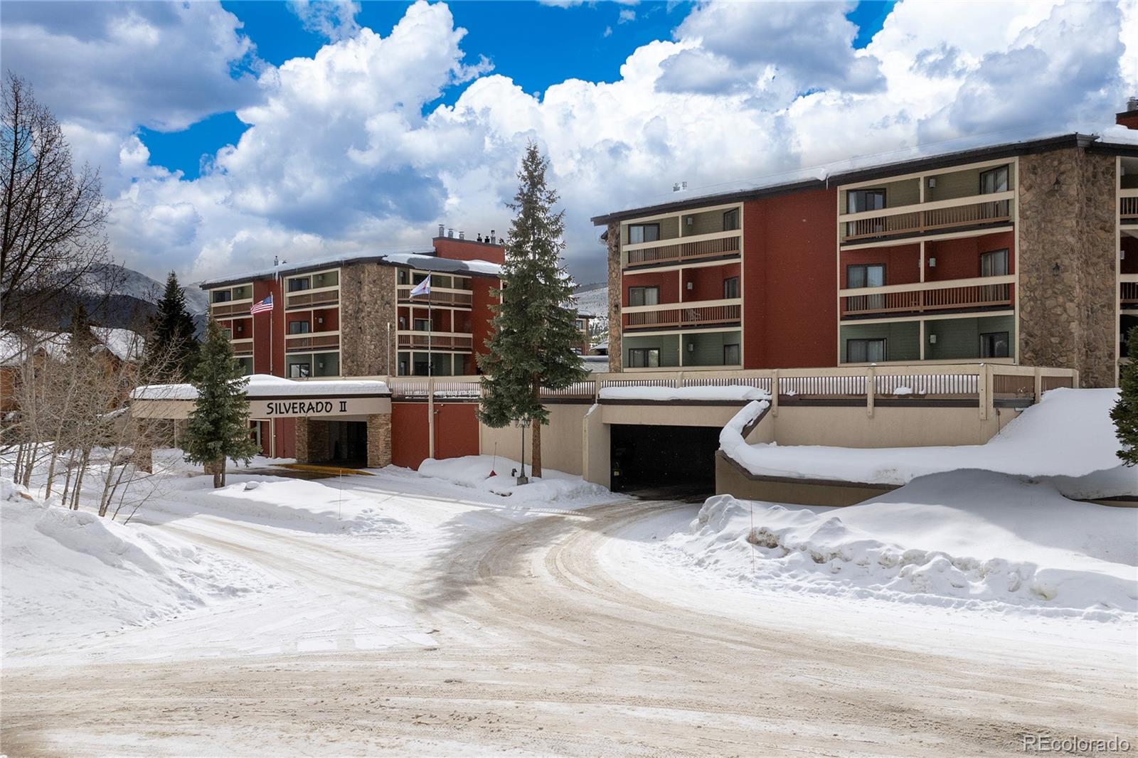 490 Kings Crossing Road, Unit 321 Winter Park, CO 80482 - Photo 42 of 46 a view of a house with a barbeque and wooden stairs