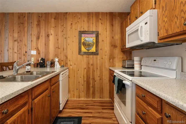 a view of a kitchen with a sink and dishwasher