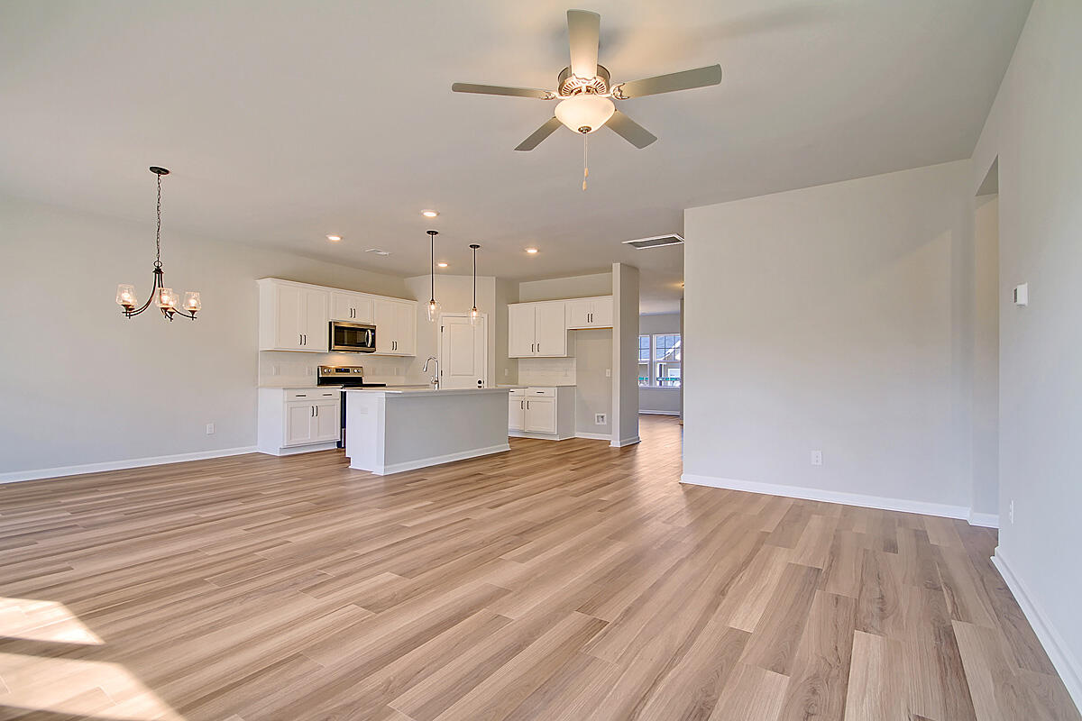 224 Cypress Plantation Road Moncks Corner, SC 29461 - Photo 15 of 35 Family Room to dining and kitchen