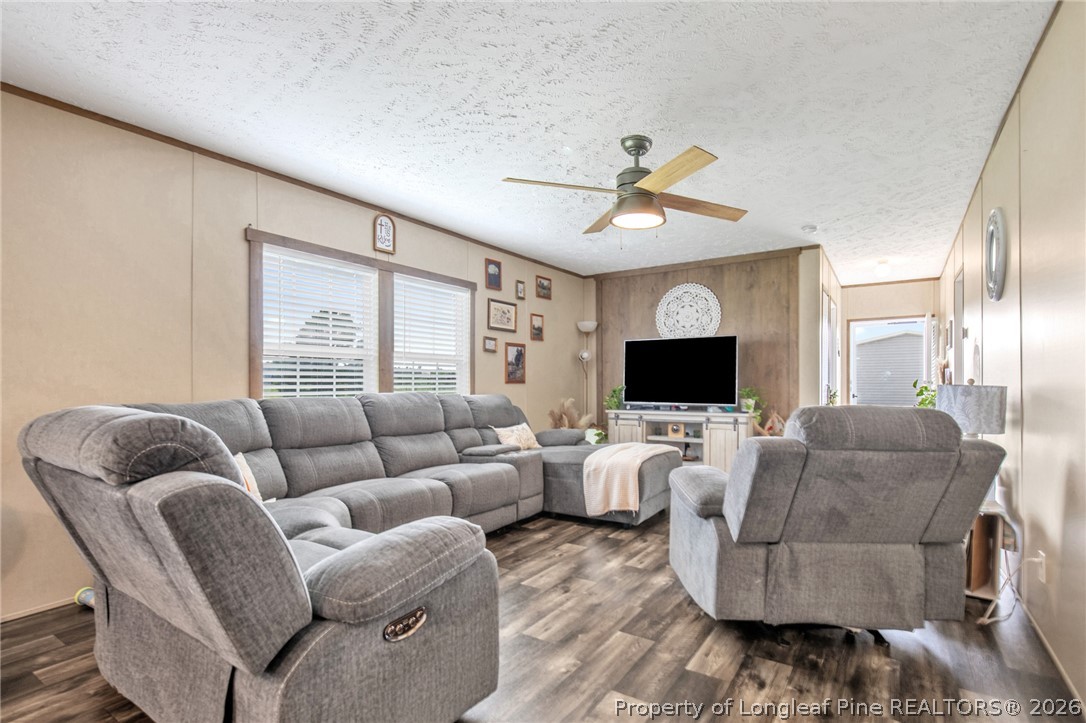 2452 Progressive Farm Road Fairmont, NC 28340 - Photo 14 of 39 a living room with furniture and a flat screen tv