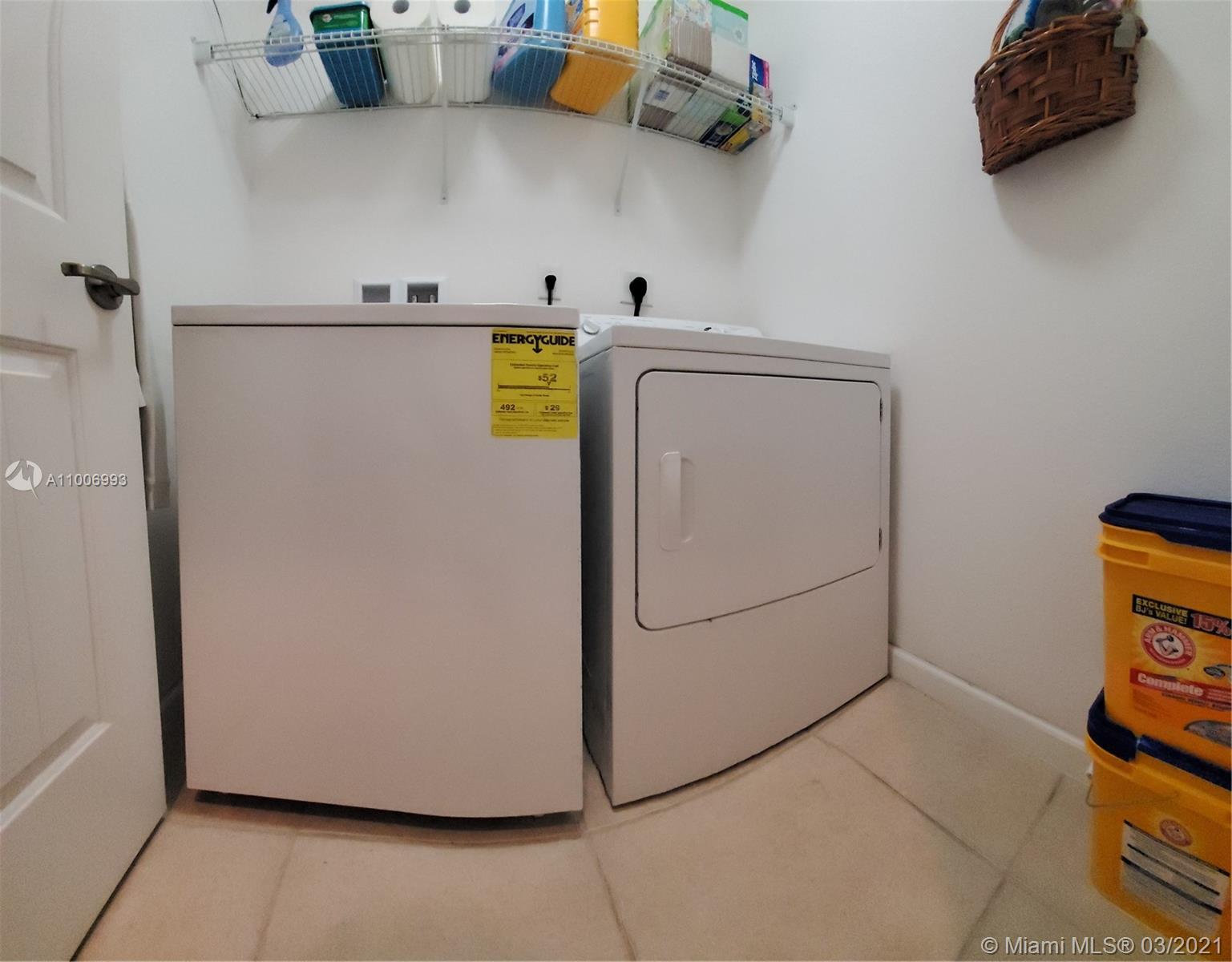 14140 Southwest 275th Street, Unit 1 Homestead, FL 33032 - Photo 16 of 25 a view of storage and utility room with washer and dryer