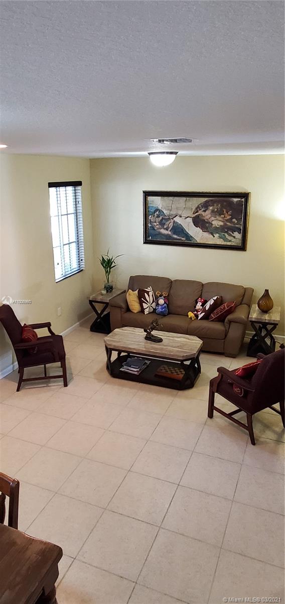 14140 Southwest 275th Street, Unit 1 Homestead, FL 33032 - Photo 20 of 25 a living room with furniture and a window