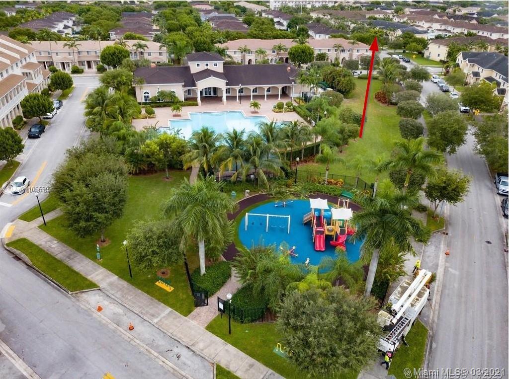 14140 Southwest 275th Street, Unit 1 Homestead, FL 33032 - Photo 22 of 25 an aerial view of multiple houses with yard