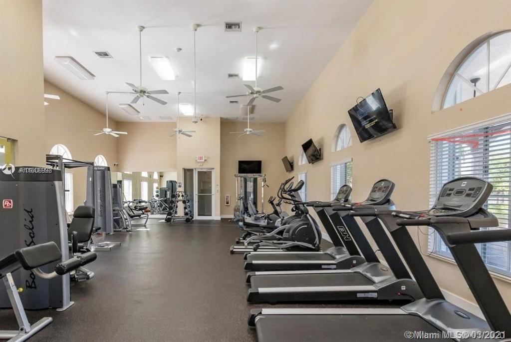 14140 Southwest 275th Street, Unit 1 Homestead, FL 33032 - Photo 25 of 25 a view of a room with gym equipment