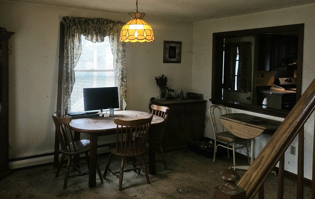 664 Norman Street Fall River, MA 02721 - Photo 11 of 12 a view of a dining room with furniture and a chandelier