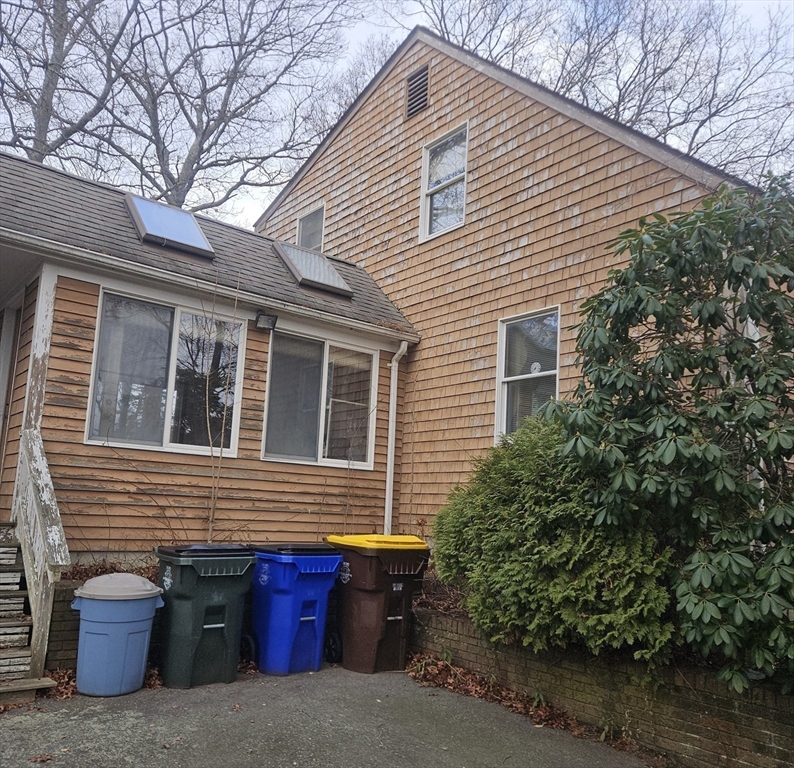 664 Norman Street Fall River, MA 02721 - Photo 4 of 12 a front view of a house with garage