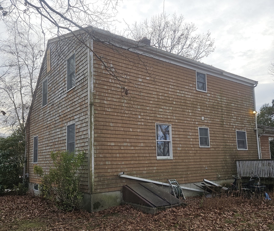 664 Norman Street Fall River, MA 02721 - Photo 6 of 12 a view of a brick house with a small space