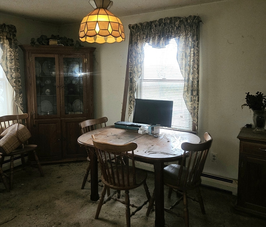 664 Norman Street Fall River, MA 02721 - Photo 10 of 12 a view of a dining room with furniture window and outside view