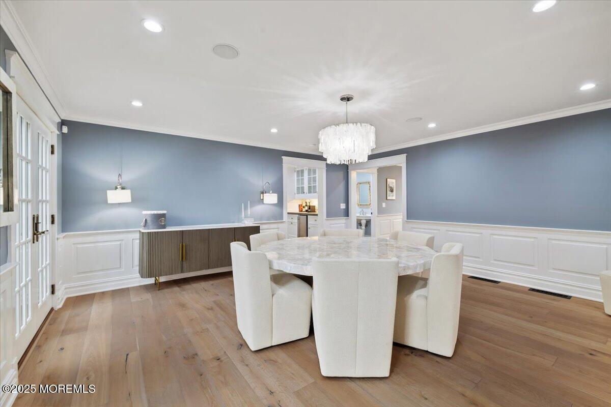 4 Broadmoor Drive Rumson, NJ 07760 - Photo 11 of 52 a large kitchen with stainless steel appliances a large counter top a sink a refrigerator and a stove