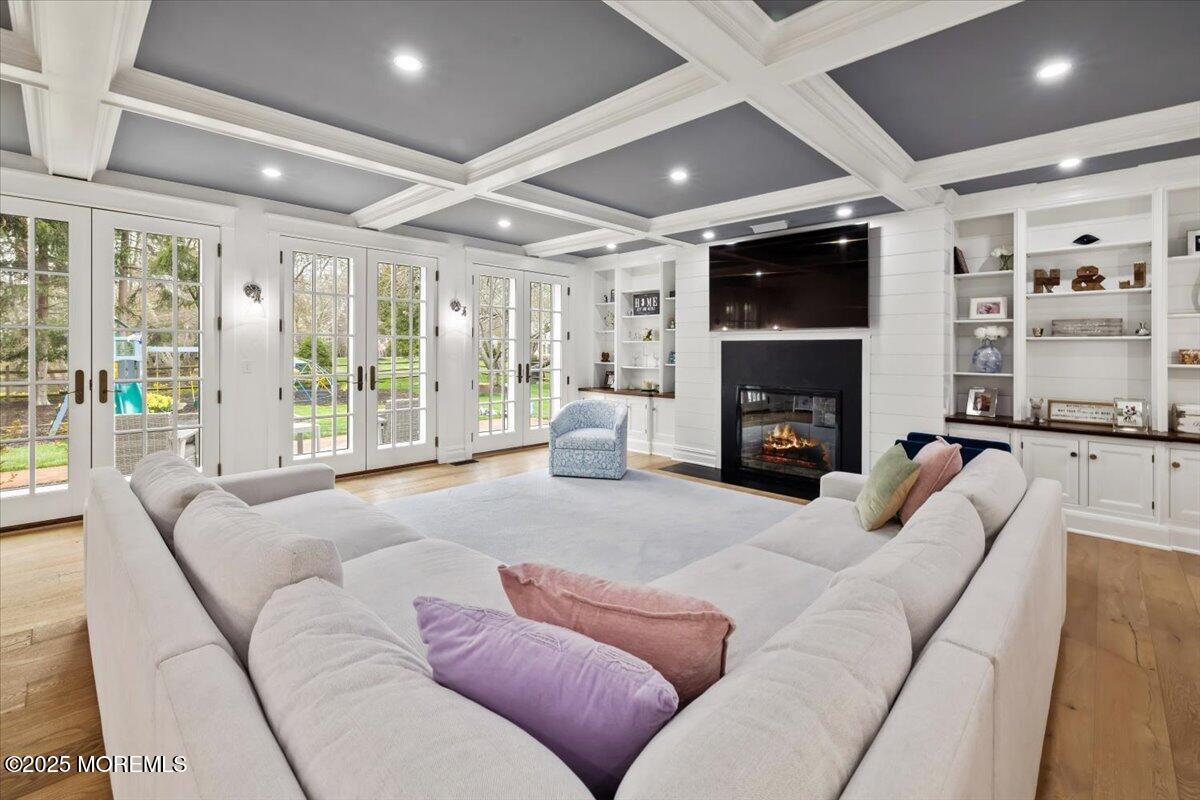 4 Broadmoor Drive Rumson, NJ 07760 - Photo 19 of 52 a living room with furniture a flat screen tv and a fireplace