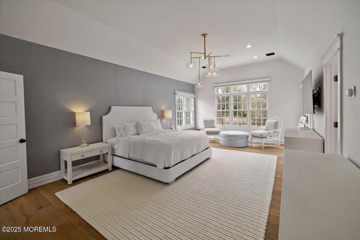 4 Broadmoor Drive Rumson, NJ 07760 - Photo 20 of 52 a spacious bedroom with a bed couch and a window