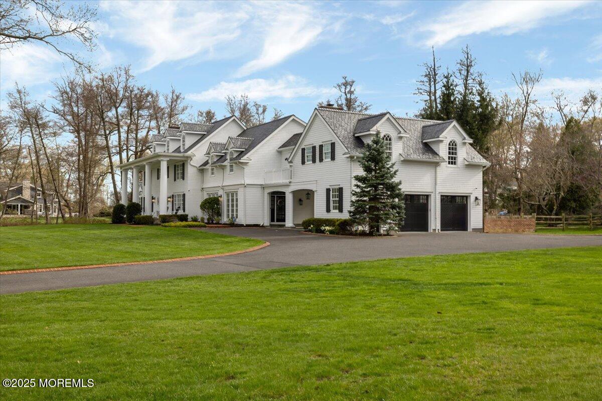 4 Broadmoor Drive Rumson, NJ 07760 - Photo 2 of 52 a view of a house with a big yard and large trees
