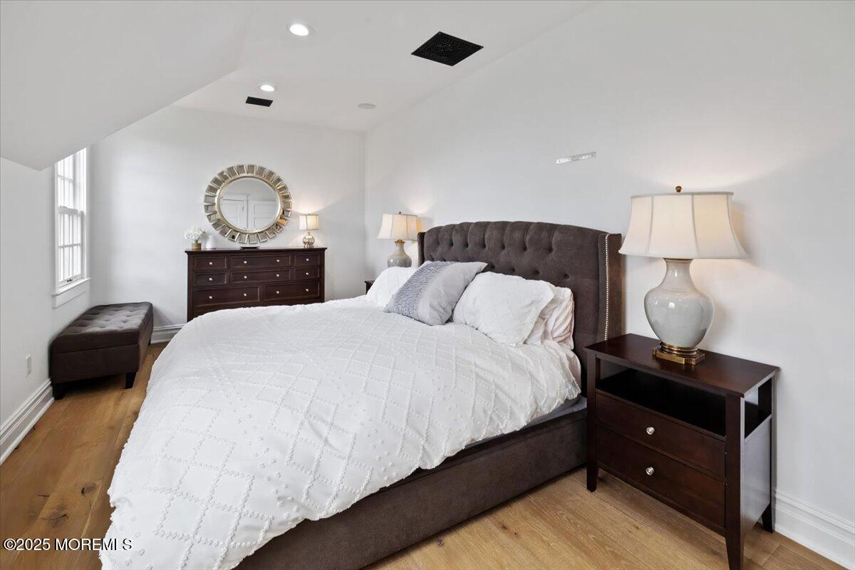 4 Broadmoor Drive Rumson, NJ 07760 - Photo 25 of 52 a bedroom with a bed and a lamp