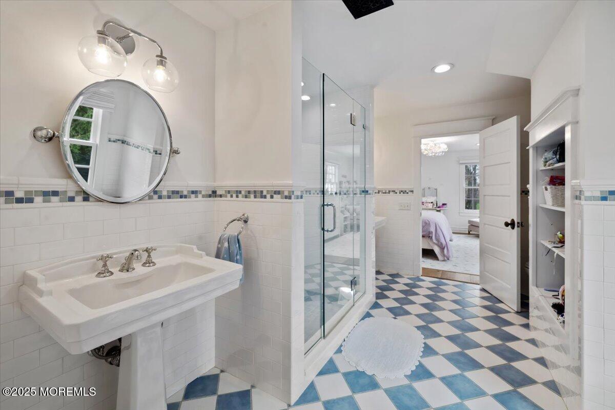 4 Broadmoor Drive Rumson, NJ 07760 - Photo 29 of 52 a bathroom with a sink a toilet and a mirror