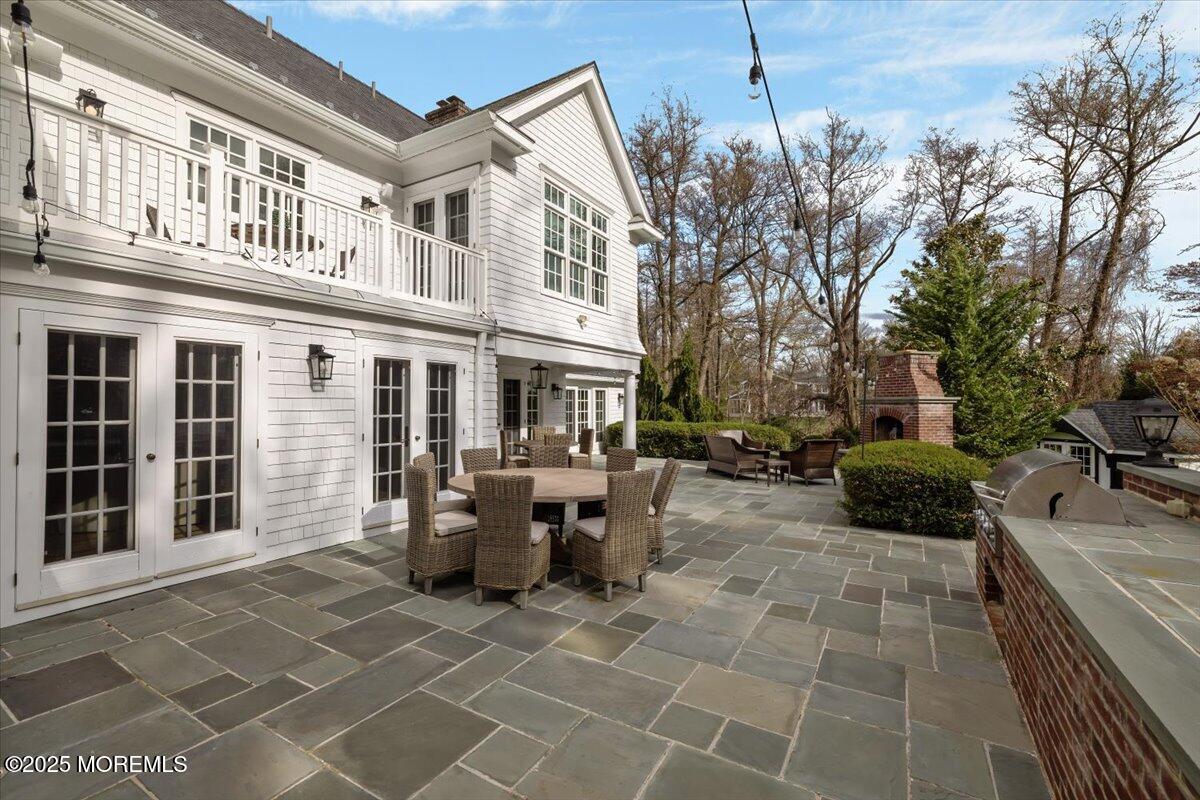 4 Broadmoor Drive Rumson, NJ 07760 - Photo 40 of 52 a view of a patio with couches and potted plants