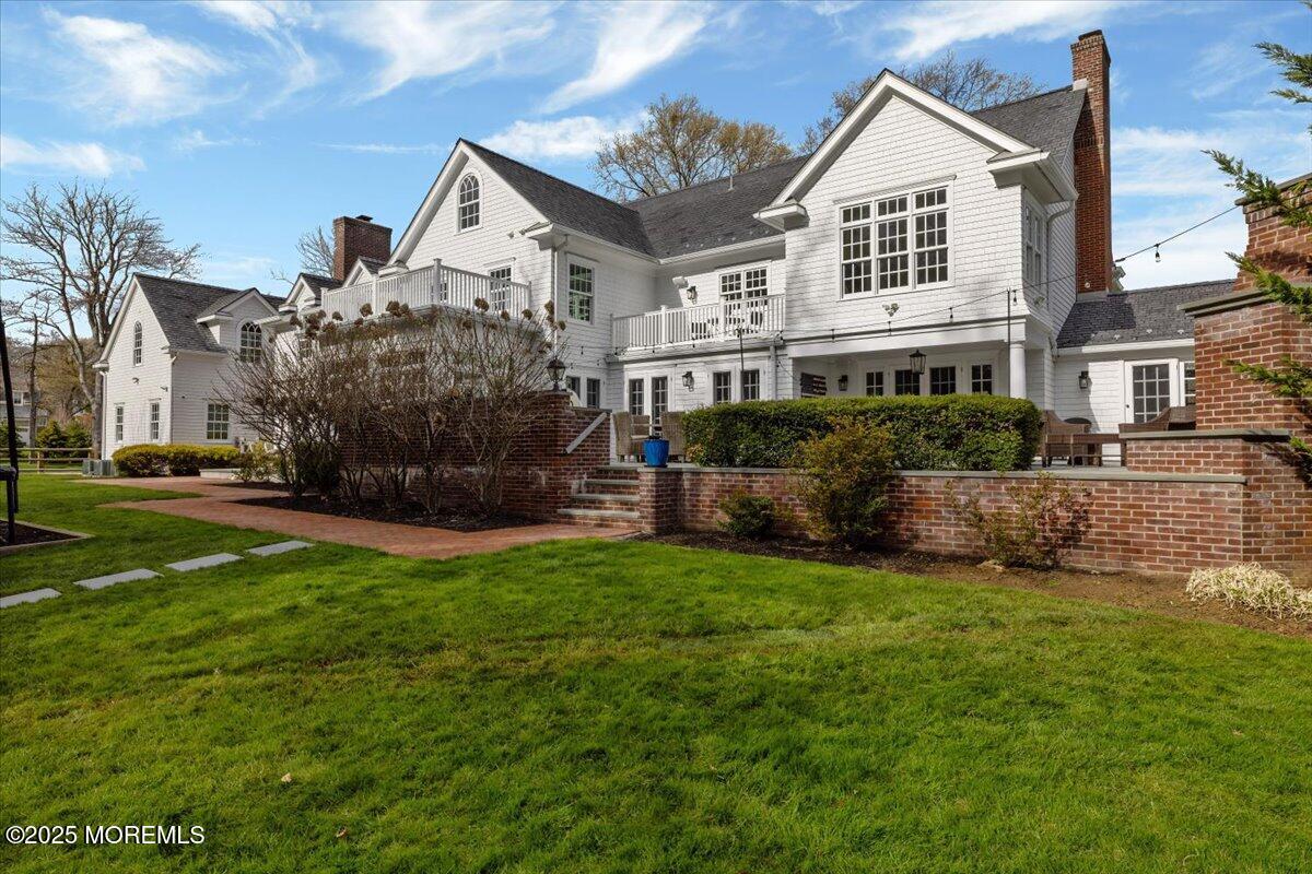 4 Broadmoor Drive Rumson, NJ 07760 - Photo 42 of 52 a front view of a house with a yard