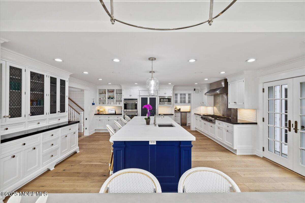 4 Broadmoor Drive Rumson, NJ 07760 - Photo 7 of 52 a large kitchen with stainless steel appliances kitchen island granite countertop a large island in the center