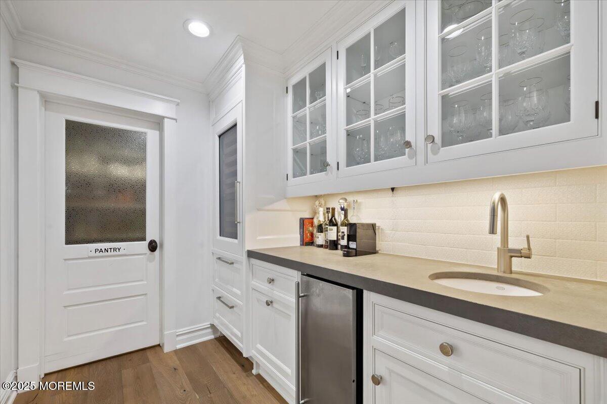 4 Broadmoor Drive Rumson, NJ 07760 - Photo 10 of 52 a bathroom with a sink and a mirror