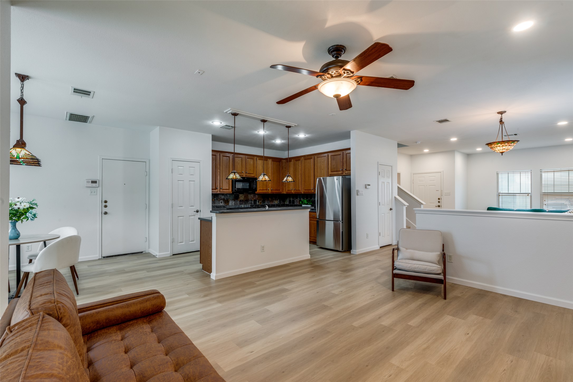 814 Bogart Road Cedar Park, TX 78613 - Photo 11 of 25 a living room with furniture and kitchen view