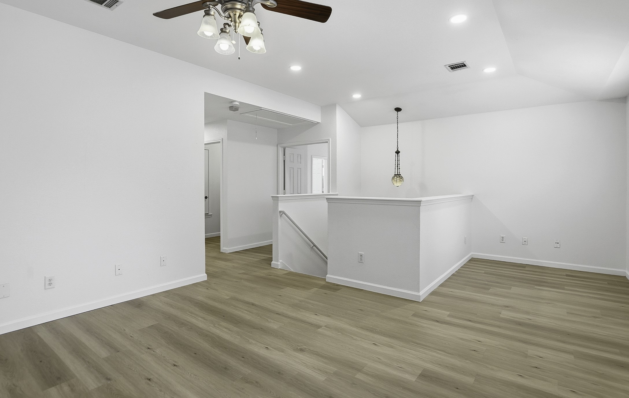 814 Bogart Road Cedar Park, TX 78613 - Photo 12 of 25 an empty room with wooden floor and ceiling fan