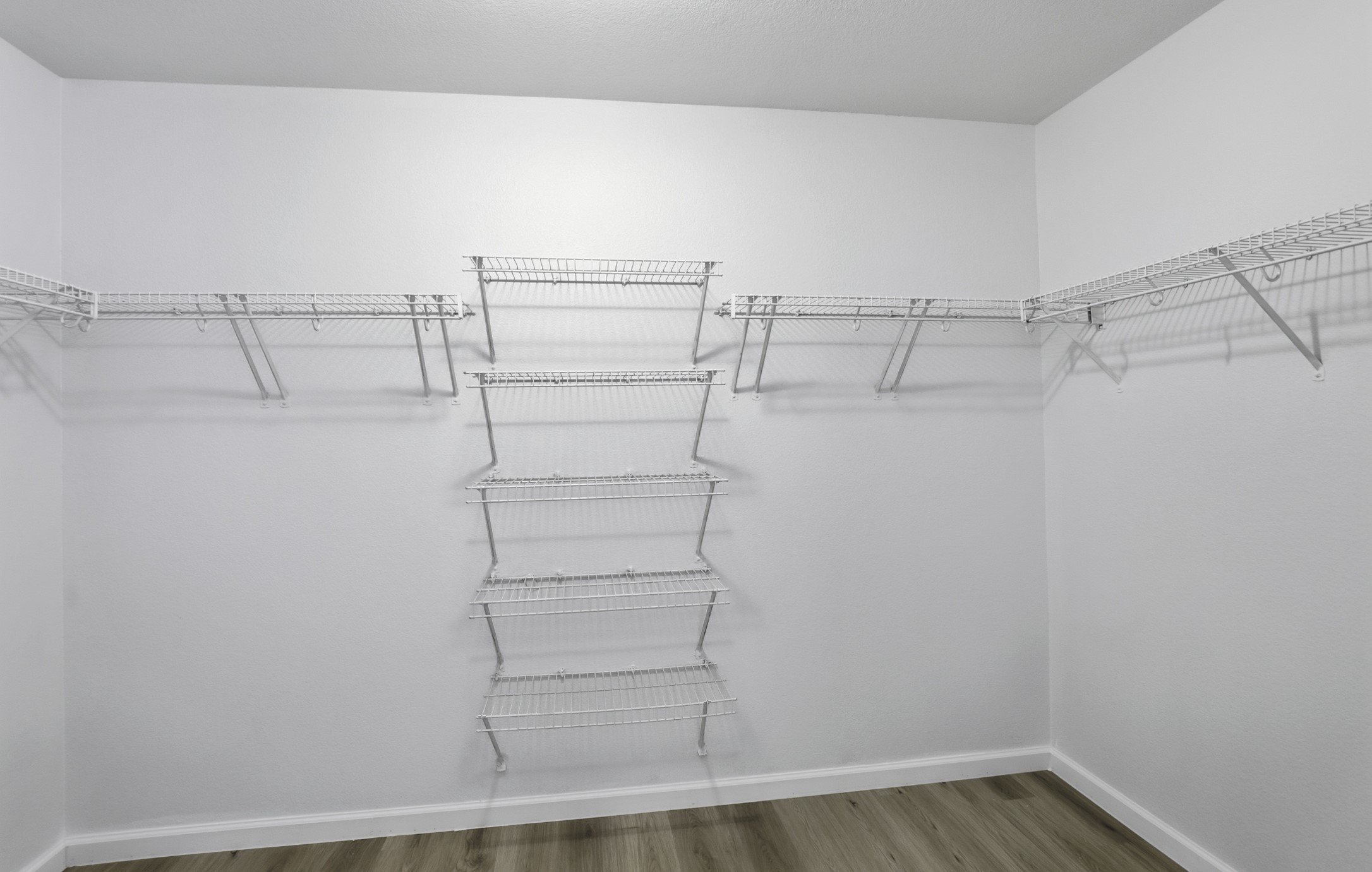 814 Bogart Road Cedar Park, TX 78613 - Photo 17 of 25 a view of walk in closet with empty racks