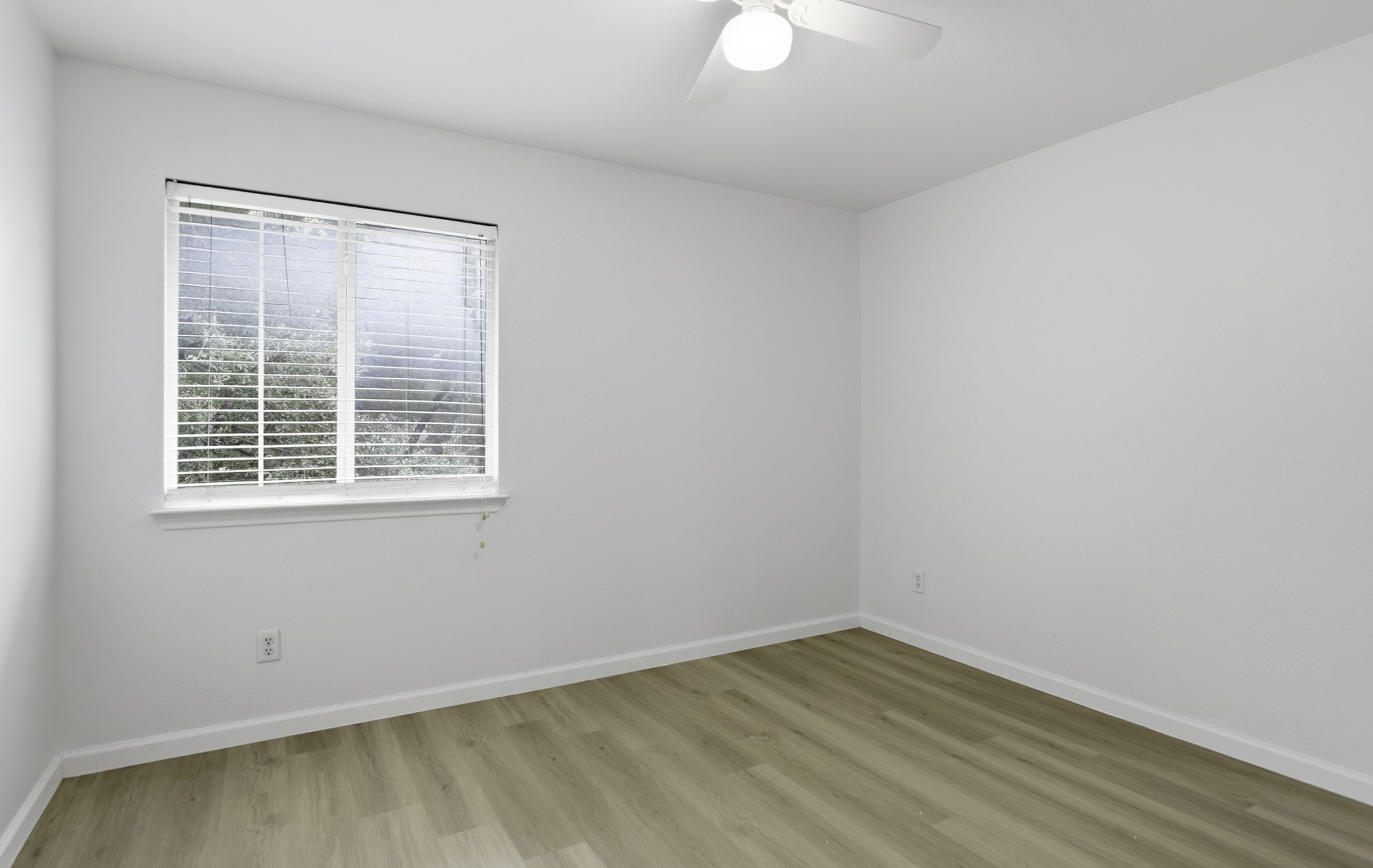 814 Bogart Road Cedar Park, TX 78613 - Photo 20 of 25 wooden floor in an empty room with a window