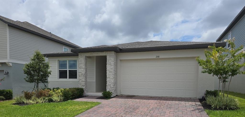 2318 Raven Rdg Drive Minneola, FL 34715 - Photo 1 of 1 a front view of a house with garden