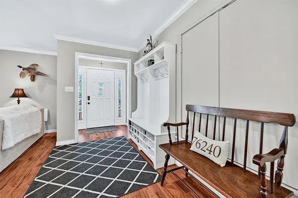 a bedroom with furniture and a window