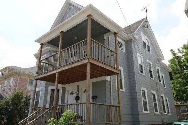 a view of a house with a small yard