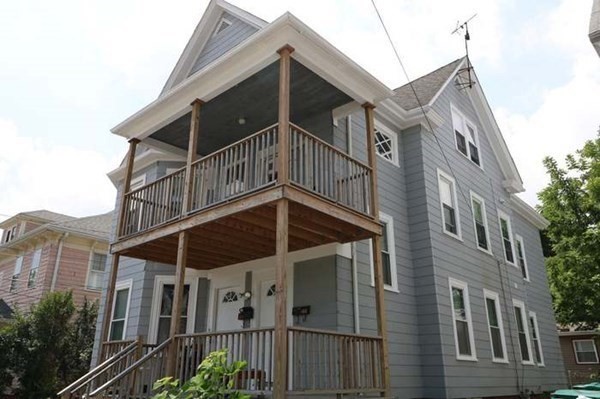 a view of a house with a small yard