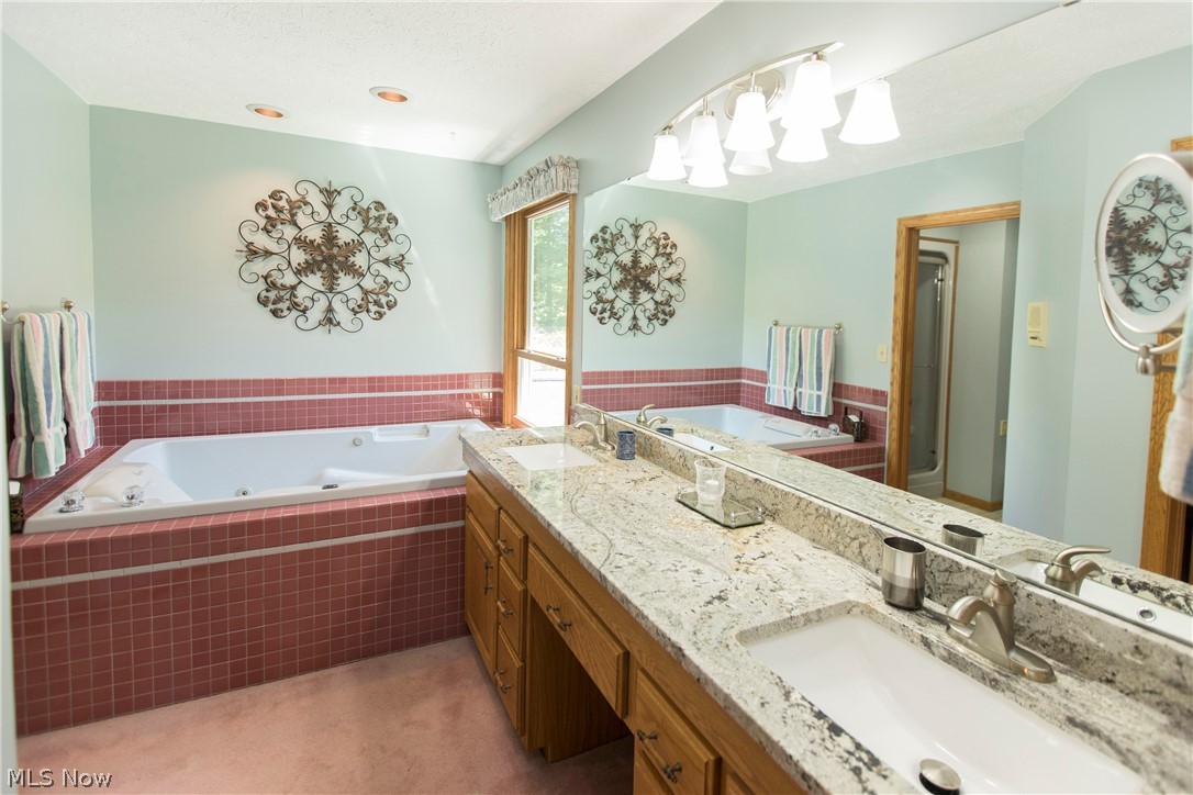 8016 Poorman Road Vermilion, OH 44089 - Photo 15 of 34 Master bath with granite counters, dual sinks and jetted tub.